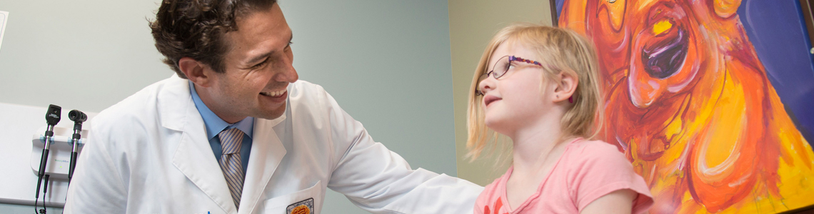 Young patient speaks with Beaumont Neurologist