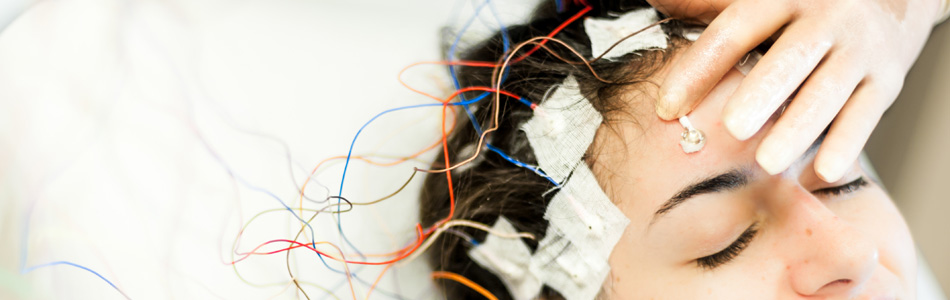Woman undergoes specialized electroencephalogram (EEG) testing for epilepsy